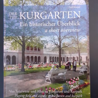 Cover of a book titled "The Kurgarten" with a garden scene and seating areas.